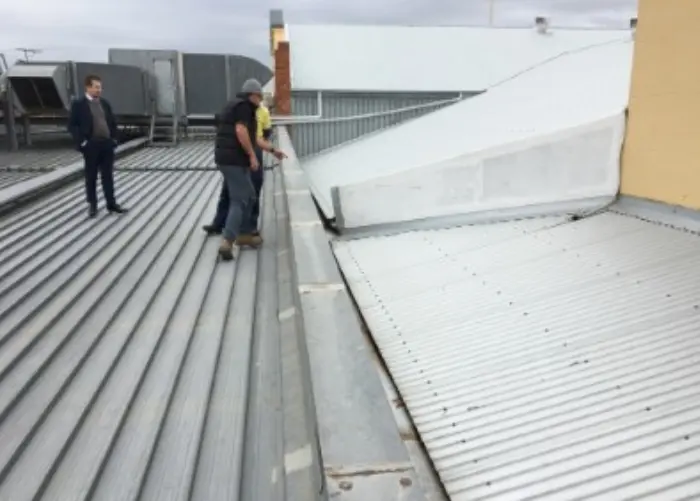 People inspecting a commercial roof